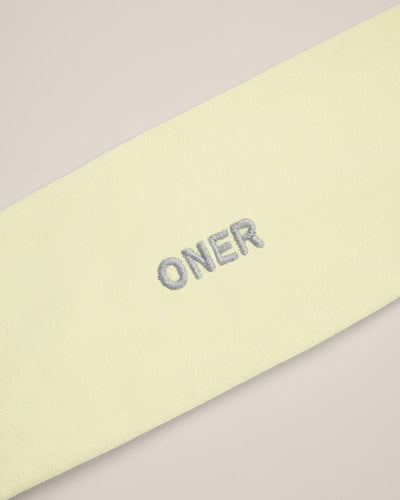 SoftMotion™ Headband with Gray Logo | Pastel Yellow