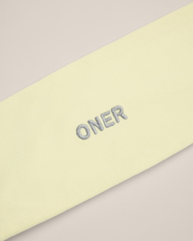 SoftMotion™ Headband with Gray Logo | Pastel Yellow