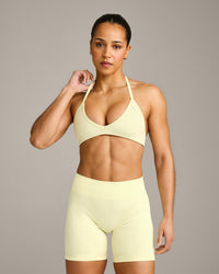 EnhanceLift™ Seamless Minimal Halter Neck Bralette with Gray Logo | Pastel Yellow