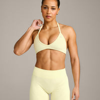 EnhanceLift™ Seamless Minimal Halter Neck Bralette with Gray Logo | Pastel Yellow