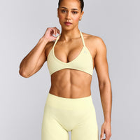 EnhanceLift™ Seamless Minimal Halter Neck Bralette with Gray Logo | Pastel Yellow