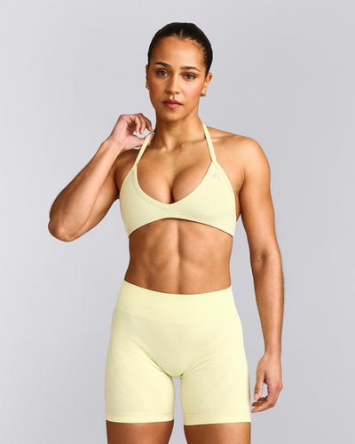 EnhanceLift™ Seamless Minimal Halter Neck Bralette with Gray Logo | Pastel Yellow