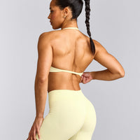 EnhanceLift™ Seamless Minimal Halter Neck Bralette with Gray Logo | Pastel Yellow