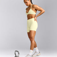 EnhanceLift™ Seamless Minimal Halter Neck Bralette with Gray Logo | Pastel Yellow