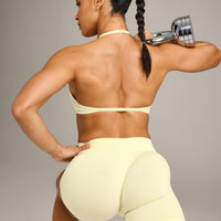 EnhanceLift™ Seamless Minimal Halter Neck Bralette with Gray Logo | Pastel Yellow