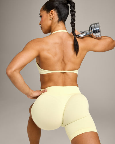 EnhanceLift™ Seamless Minimal Halter Neck Bralette with Gray Logo | Pastel Yellow