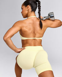 EnhanceLift™ Seamless Minimal Halter Neck Bralette with Gray Logo | Pastel Yellow