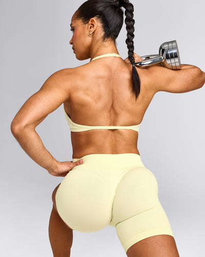 EnhanceLift™ Seamless Minimal Halter Neck Bralette with Gray Logo | Pastel Yellow