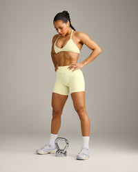 EnhanceLift™ Seamless Minimal Halter Neck Bralette with Gray Logo | Pastel Yellow