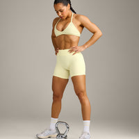 EnhanceLift™ Seamless Minimal Halter Neck Bralette with Gray Logo | Pastel Yellow