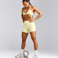 EnhanceLift™ Seamless Minimal Halter Neck Bralette with Gray Logo | Pastel Yellow