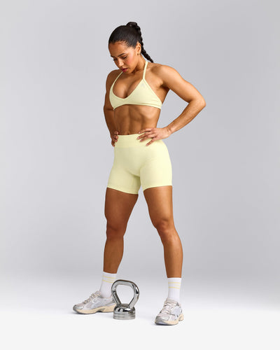 EnhanceLift™ Seamless Minimal Halter Neck Bralette with Gray Logo | Pastel Yellow