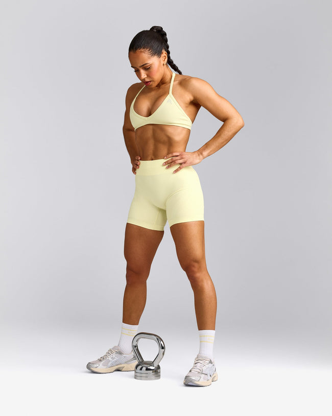 EnhanceLift™ Seamless Minimal Halter Neck Bralette with Gray Logo | Pastel Yellow