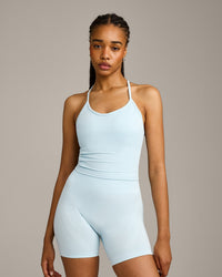 EnhanceLift™ Seamless Strappy Racer Tank Top with Built in Bra Shelf with Gray Logo | Cloud Blue