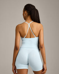 EnhanceLift™ Seamless Strappy Racer Tank Top with Built in Bra Shelf with Gray Logo | Cloud Blue