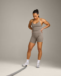 EnhanceLift™ Seamless Strappy Racer Tank Top with Built in Bra Shelf with Gray Logo | Warm Minky