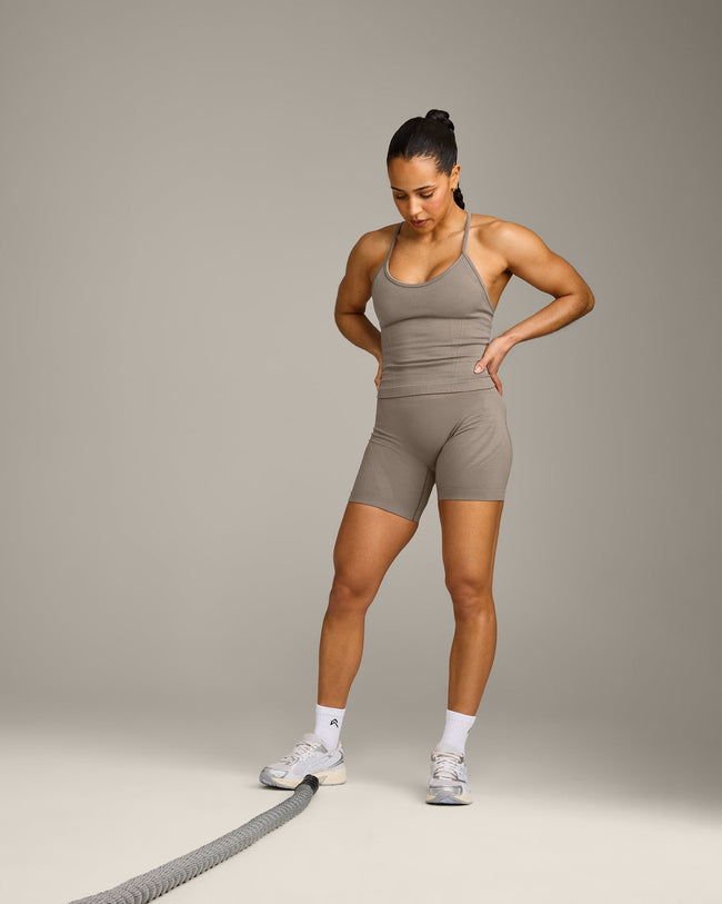 EnhanceLift™ Seamless Strappy Racer Tank Top with Built in Bra Shelf with Gray Logo | Warm Minky