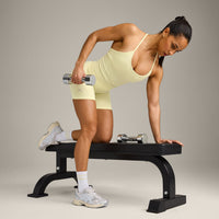 EnhanceLift™ Seamless Strappy Racer Tank Top with Built in Bra Shelf with Gray Logo | Pastel Yellow