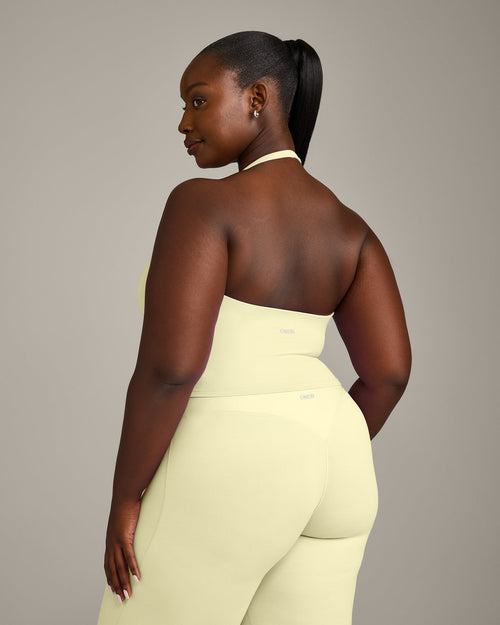 SoftMotion™ Halter Neck Mid Tank Top with Built in Bra Shelf with Gray Logo | Pastel Yellow