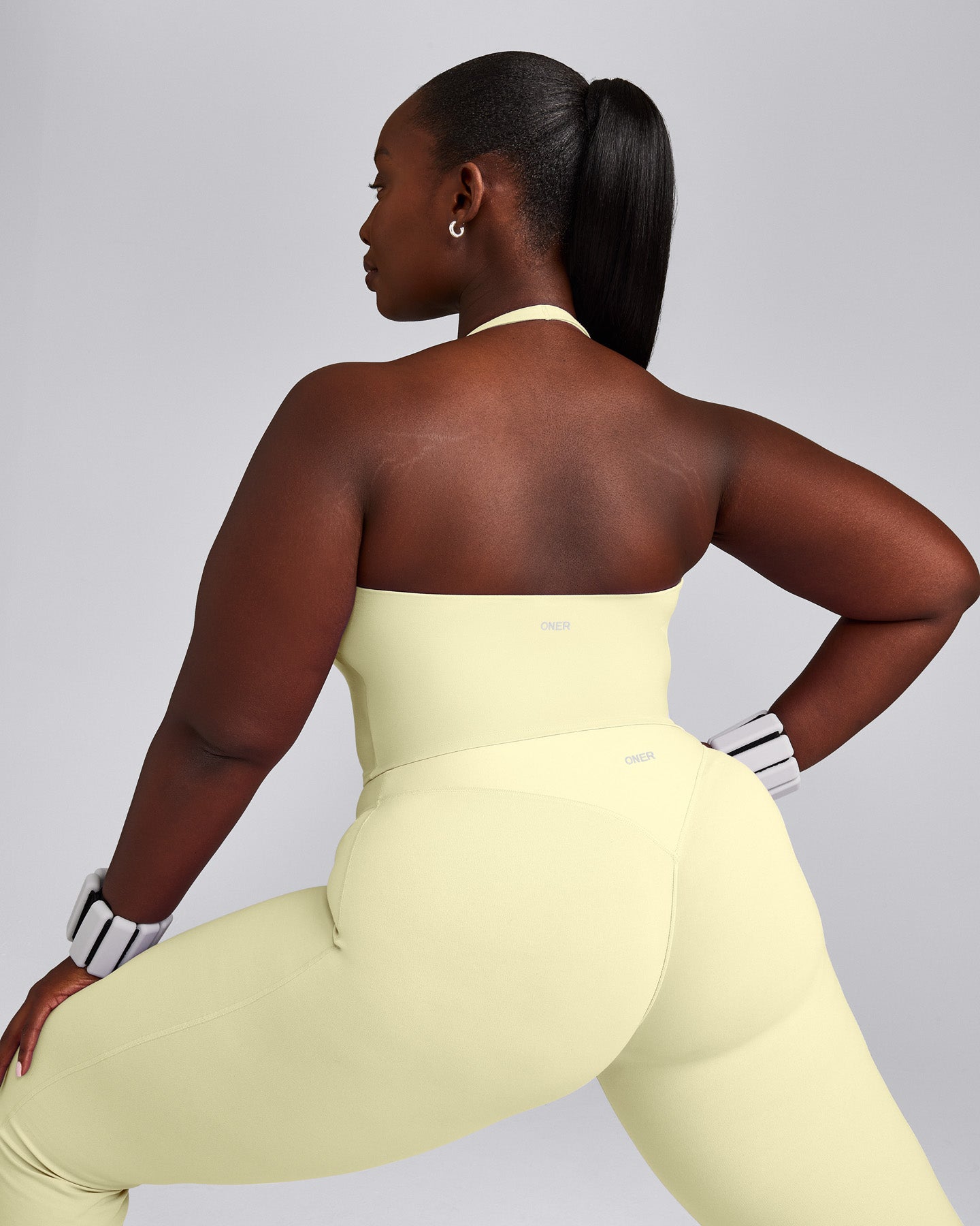 SoftMotion™ Halter Neck Mid Tank Top with Built in Bra Shelf with Gray Logo | Pastel Yellow