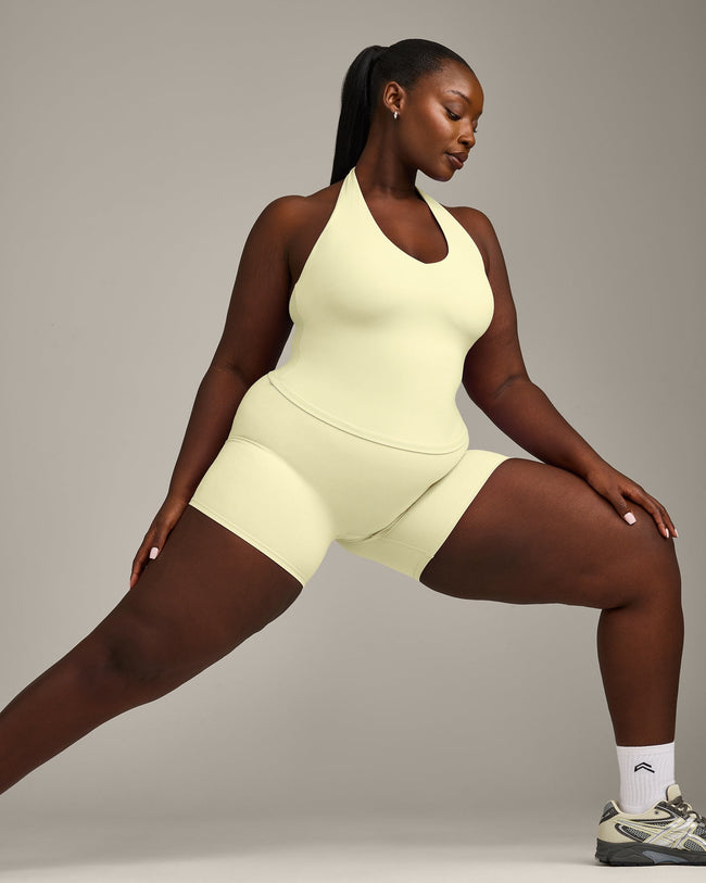 SoftMotion™ Halter Neck Tank Top with Built in Bra Shelf with Gray Logo | Pastel Yellow