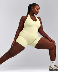 SoftMotion™ Halter Neck Tank Top with Built in Bra Shelf with Gray Logo | Pastel Yellow