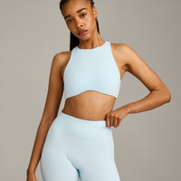 SoftMotion™ High Neck Sports Bra with Gray Logo | Cloud Blue