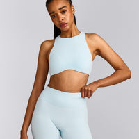 SoftMotion™ High Neck Sports Bra with Gray Logo | Cloud Blue