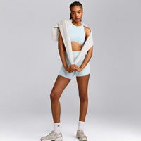 SoftMotion™ High Neck Sports Bra with Gray Logo | Cloud Blue