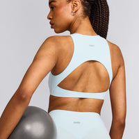 SoftMotion™ High Neck Sports Bra with Gray Logo | Cloud Blue