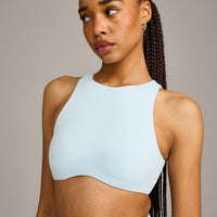 SoftMotion™ High Neck Sports Bra with Gray Logo | Cloud Blue