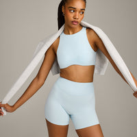 SoftMotion™ High Neck Sports Bra with Gray Logo | Cloud Blue
