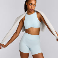 SoftMotion™ High Neck Sports Bra with Gray Logo | Cloud Blue