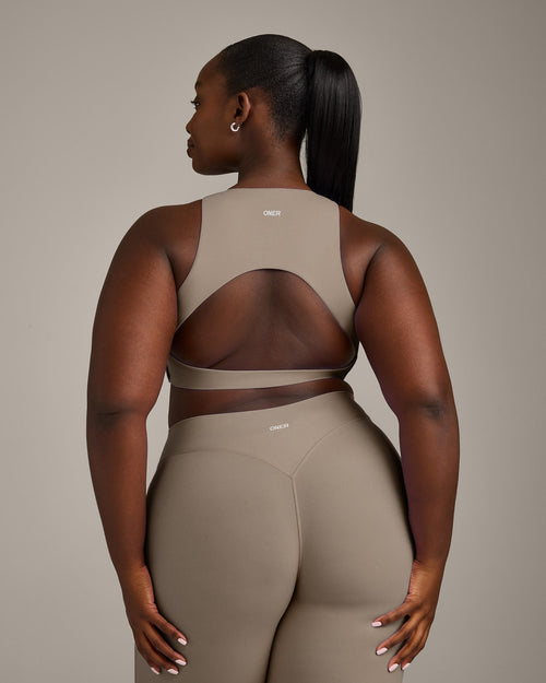 SoftMotion™ High Neck Sports Bra with Gray Logo | Minky