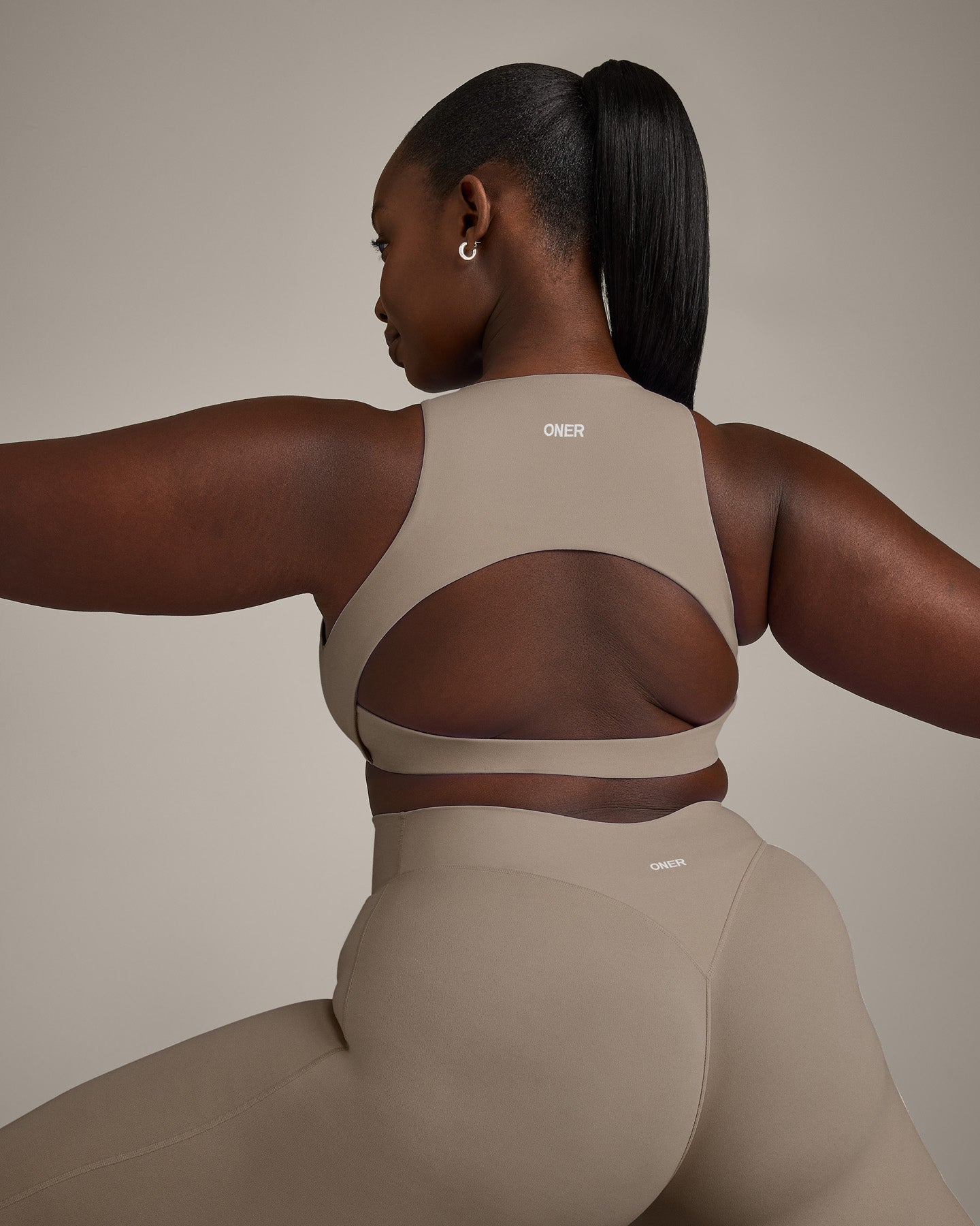 SoftMotion™ High Neck Sports Bra with Gray Logo | Minky