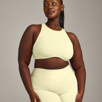 SoftMotion™ High Neck Sports Bra with Gray Logo | Pastel Yellow