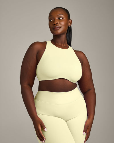 SoftMotion™ High Neck Sports Bra with Gray Logo | Pastel Yellow