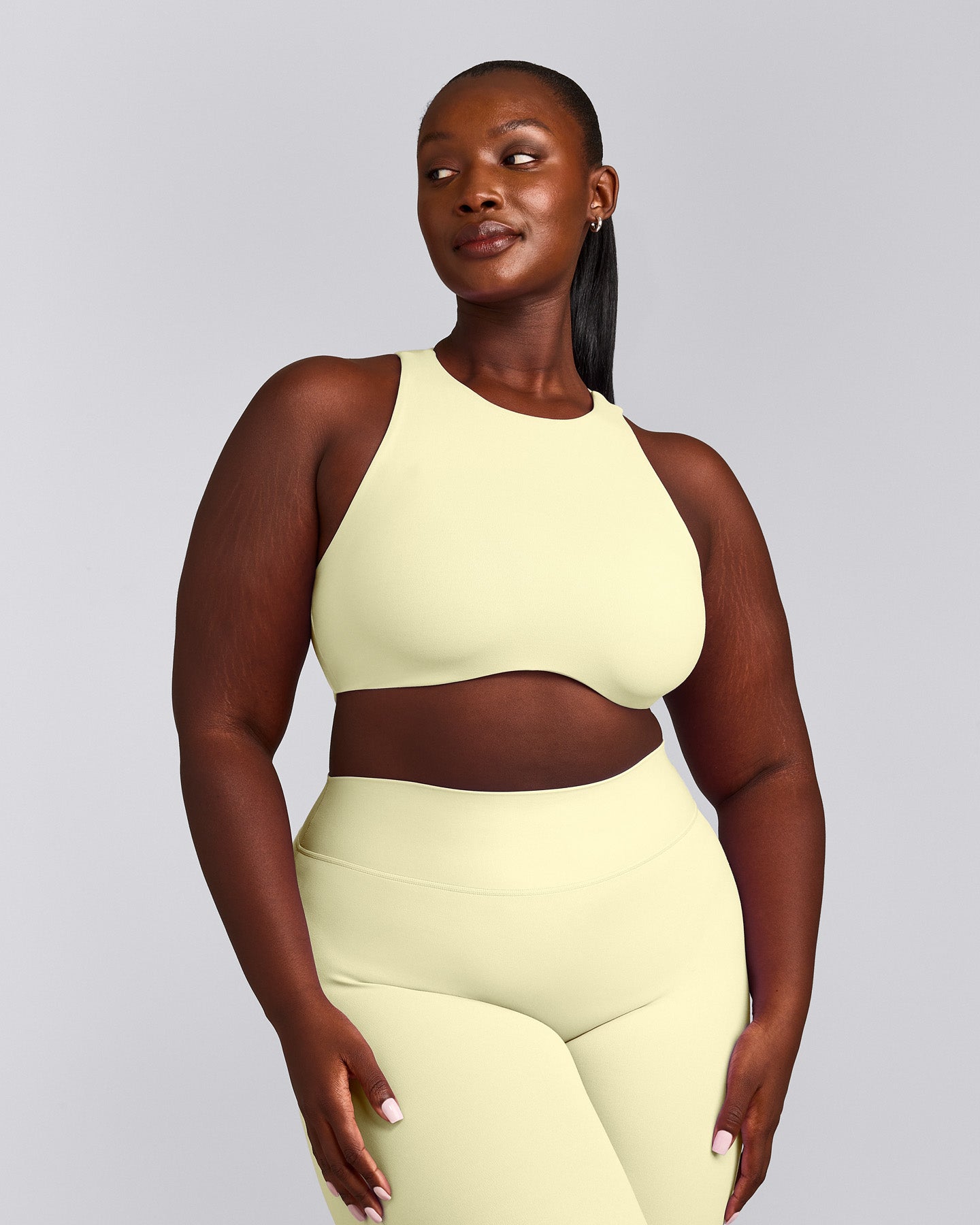 SoftMotion™ High Neck Sports Bra with Gray Logo | Pastel Yellow
