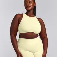 SoftMotion™ High Neck Sports Bra with Gray Logo | Pastel Yellow
