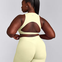 SoftMotion™ High Neck Sports Bra with Gray Logo | Pastel Yellow