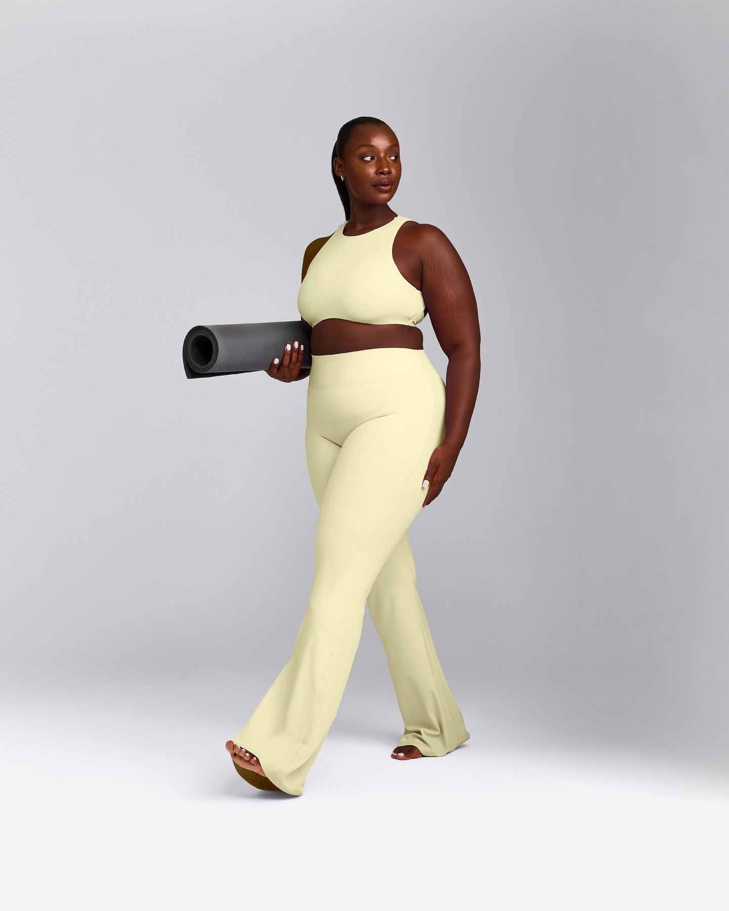 SoftMotion™ High Neck Sports Bra with Gray Logo | Pastel Yellow
