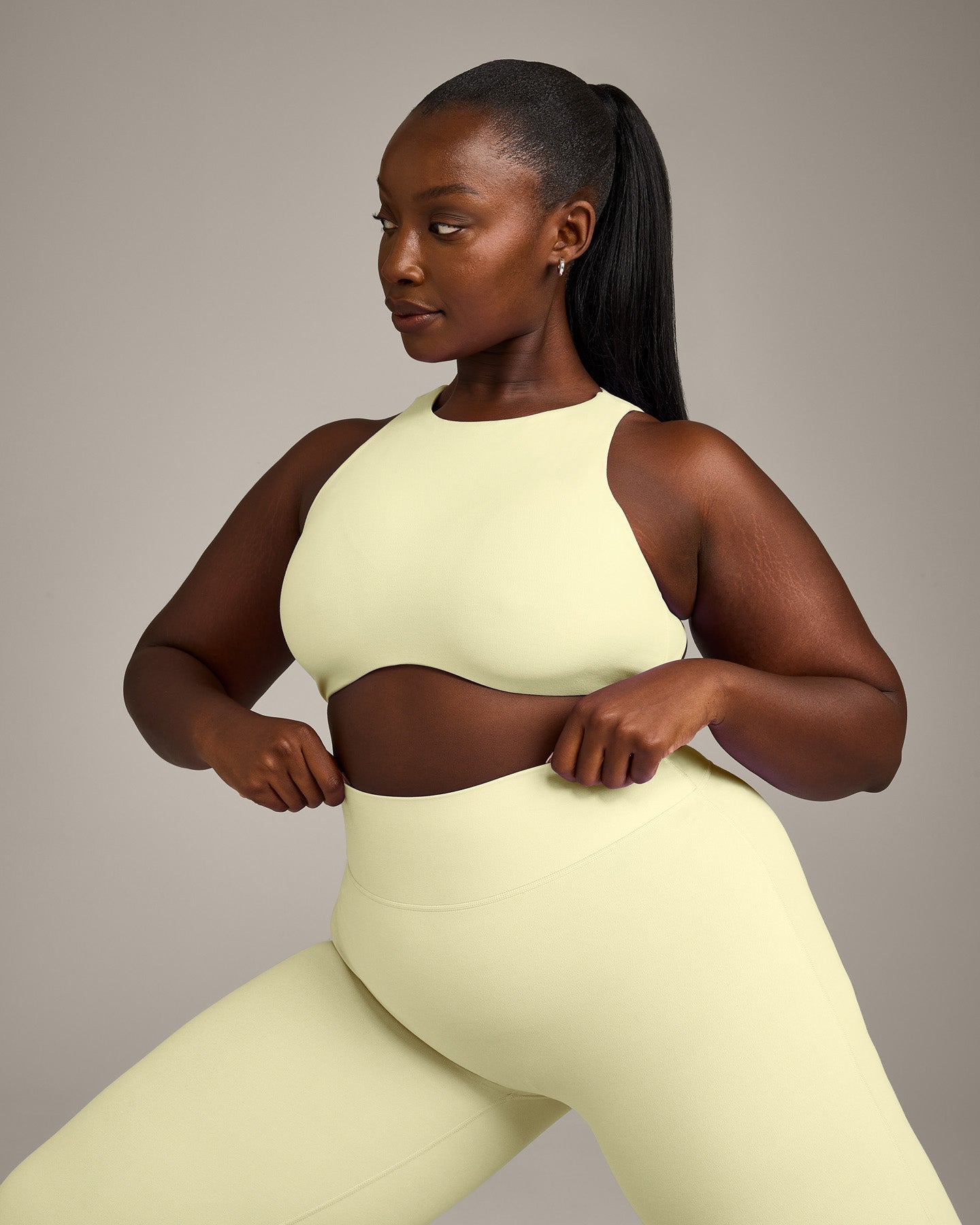 SoftMotion™ High Neck Sports Bra with Gray Logo | Pastel Yellow