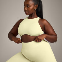 SoftMotion™ High Neck Sports Bra with Gray Logo | Pastel Yellow