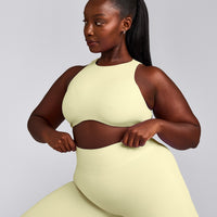 SoftMotion™ High Neck Sports Bra with Gray Logo | Pastel Yellow