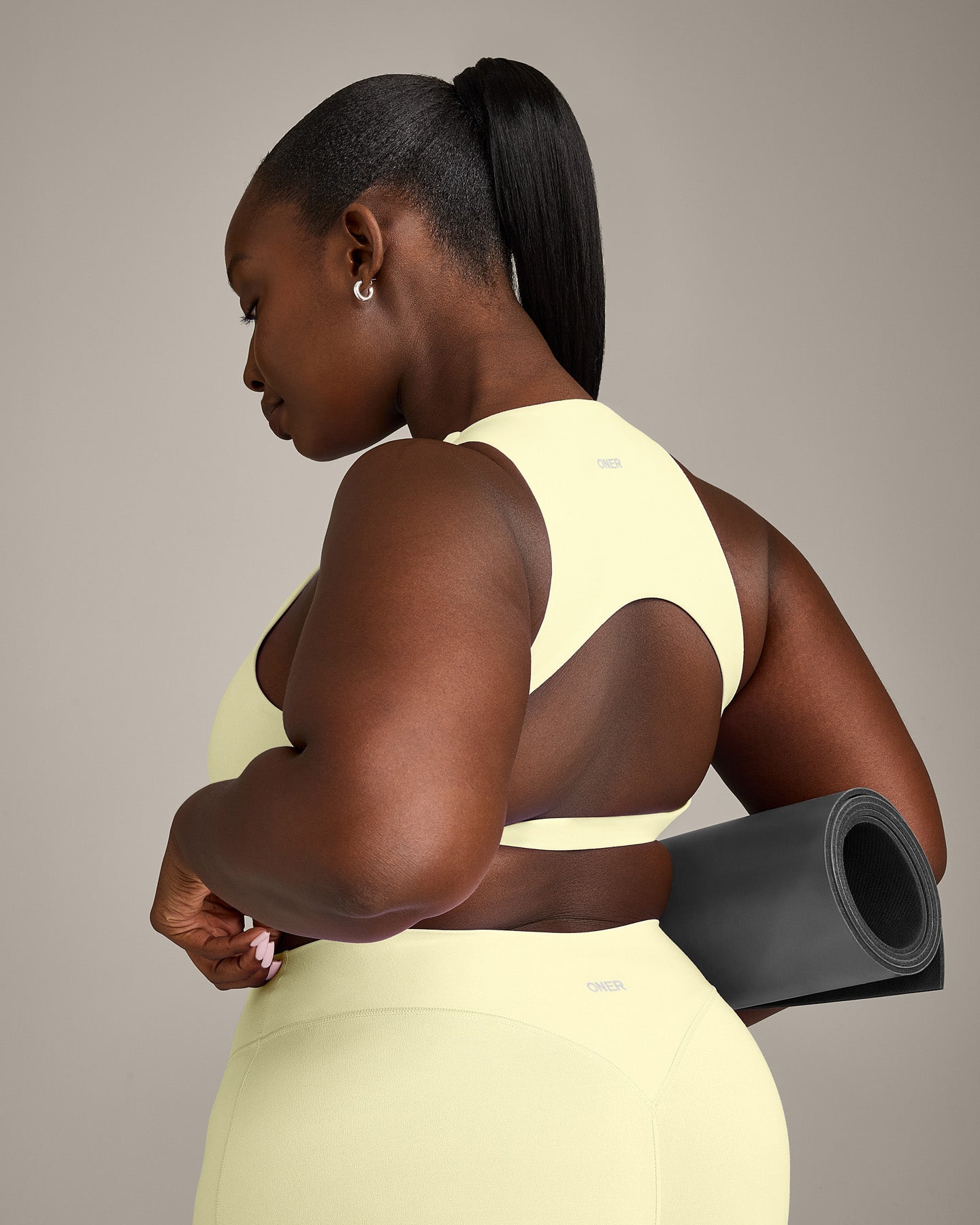 SoftMotion™ High Neck Sports Bra with Gray Logo | Pastel Yellow