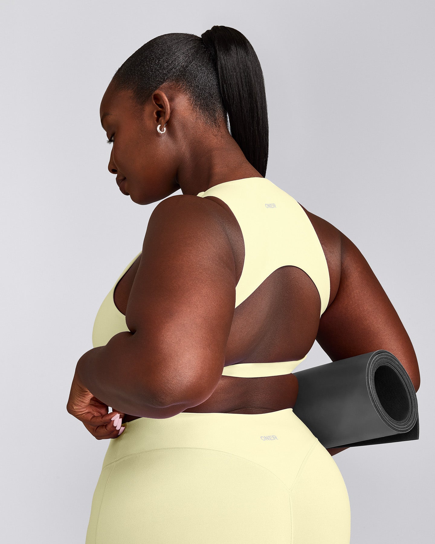 SoftMotion™ High Neck Sports Bra with Gray Logo | Pastel Yellow