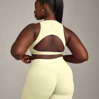 SoftMotion™ High Neck Sports Bra with Gray Logo | Pastel Yellow