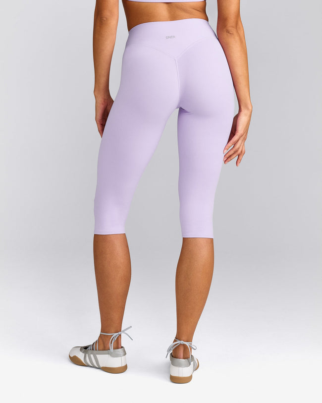 SoftMotion™ High Waisted Capri Leggings with Gray Logo | Lavender Purple