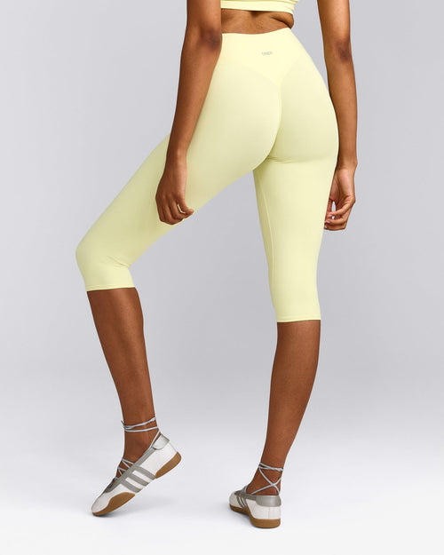 SoftMotion™ High Waisted Capri Leggings with Gray Logo | Pastel Yellow