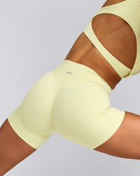 SoftMotion™ High Waisted Shorts 6" with Gray Logo | Pastel Yellow